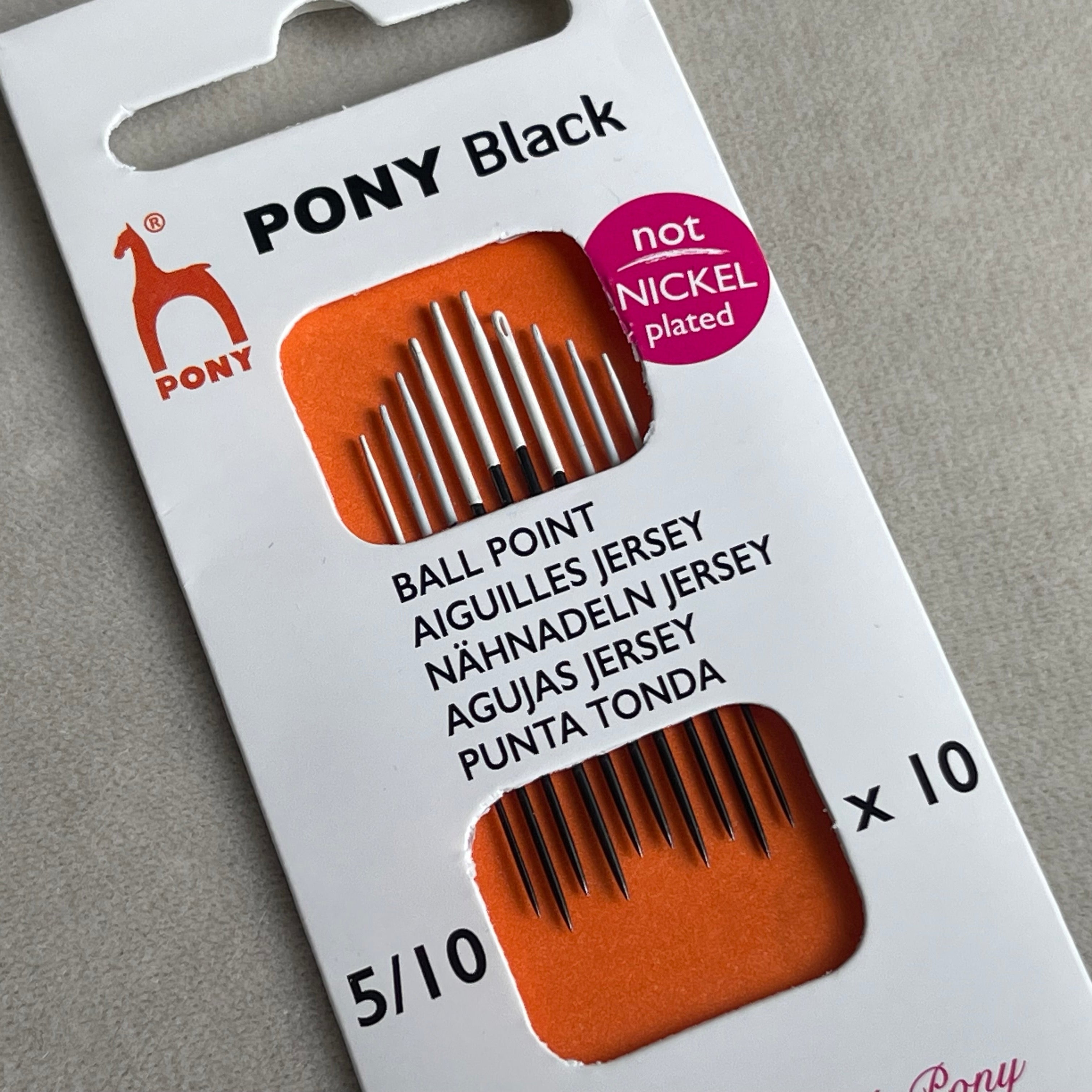 Pony black ballpoint needles packaging on a gray background