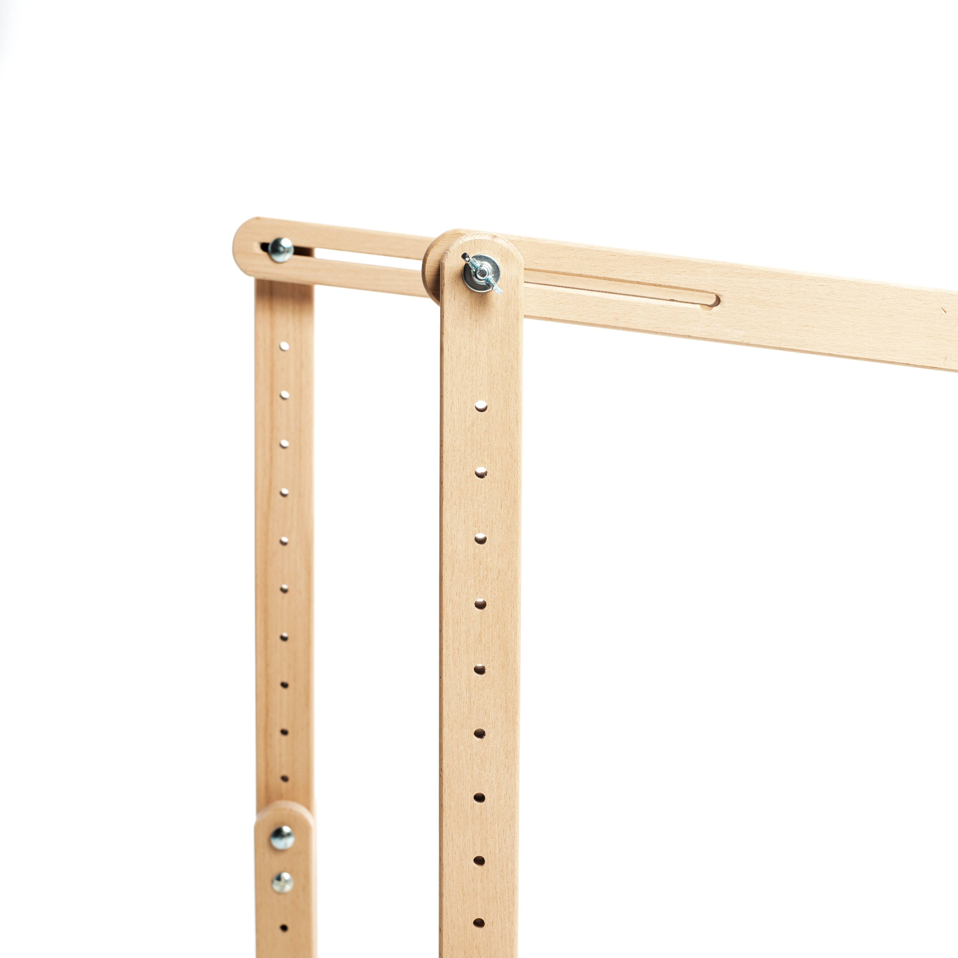 Embroidery frame and trestles (with height adjustment). The design consists of a removable frame and support, which allows you to adjust the height of the legs, as well as the tilt.